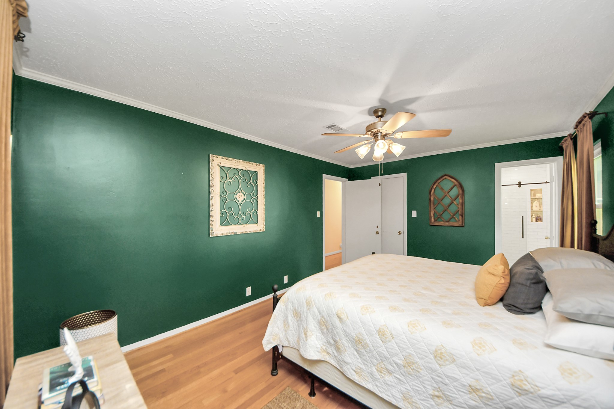 205 Cedar Lane El Lago, TX 77586 - Photo 22 of 44 a bedroom with a bed and a chandelier