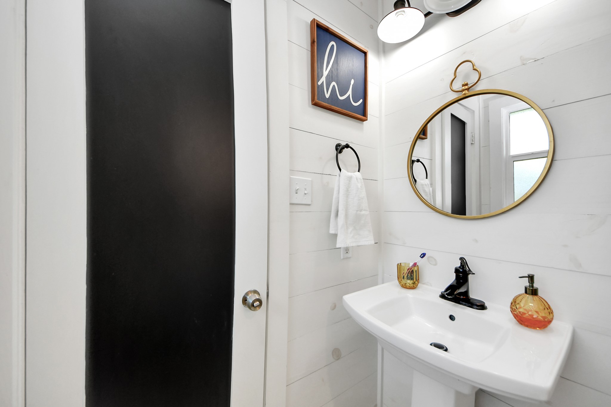 205 Cedar Lane El Lago, TX 77586 - Photo 26 of 44 a bathroom with a sink and a mirror