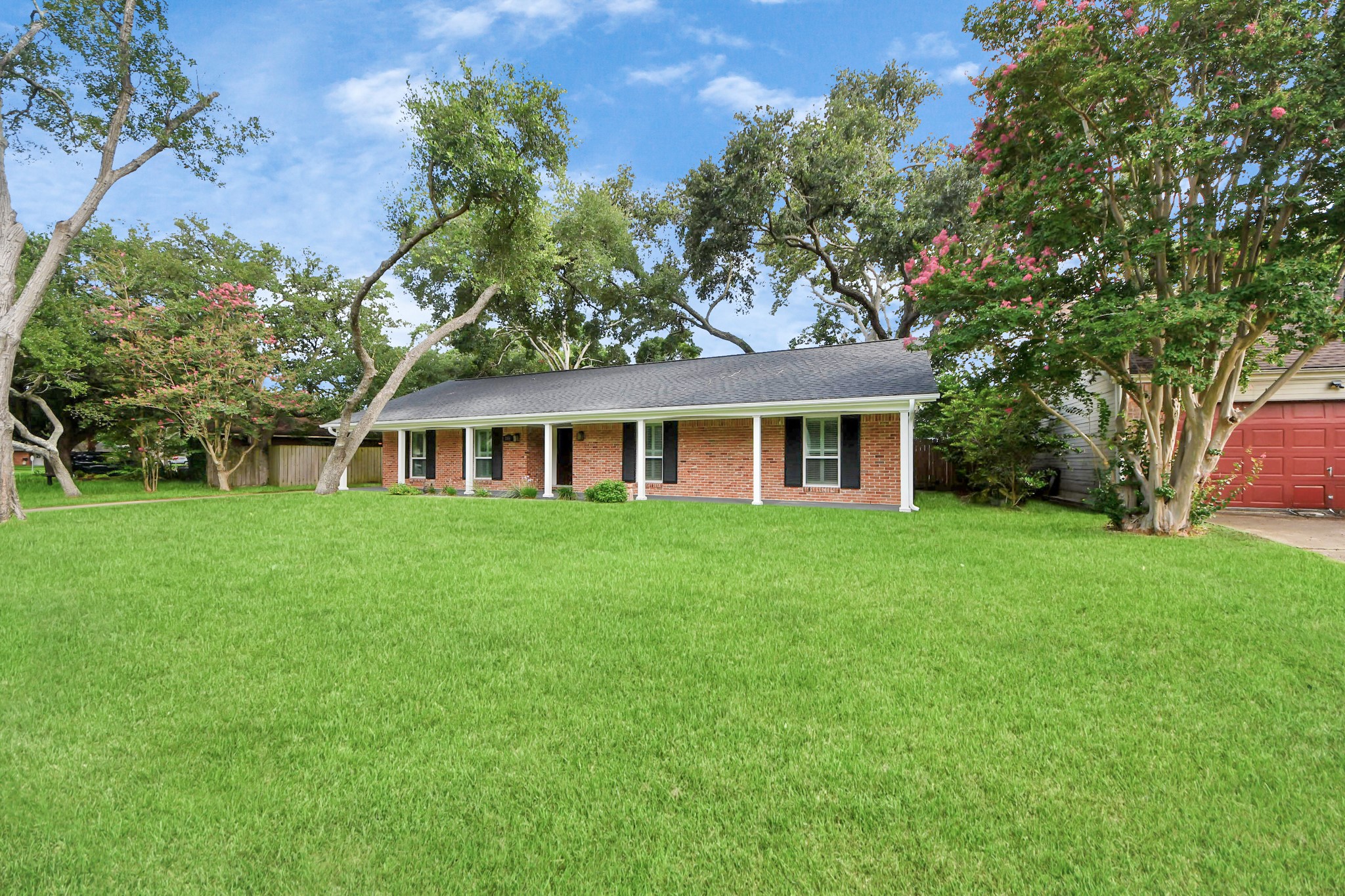 205 Cedar Lane El Lago, TX 77586 - Photo 41 of 44 a front view of a house with a garden