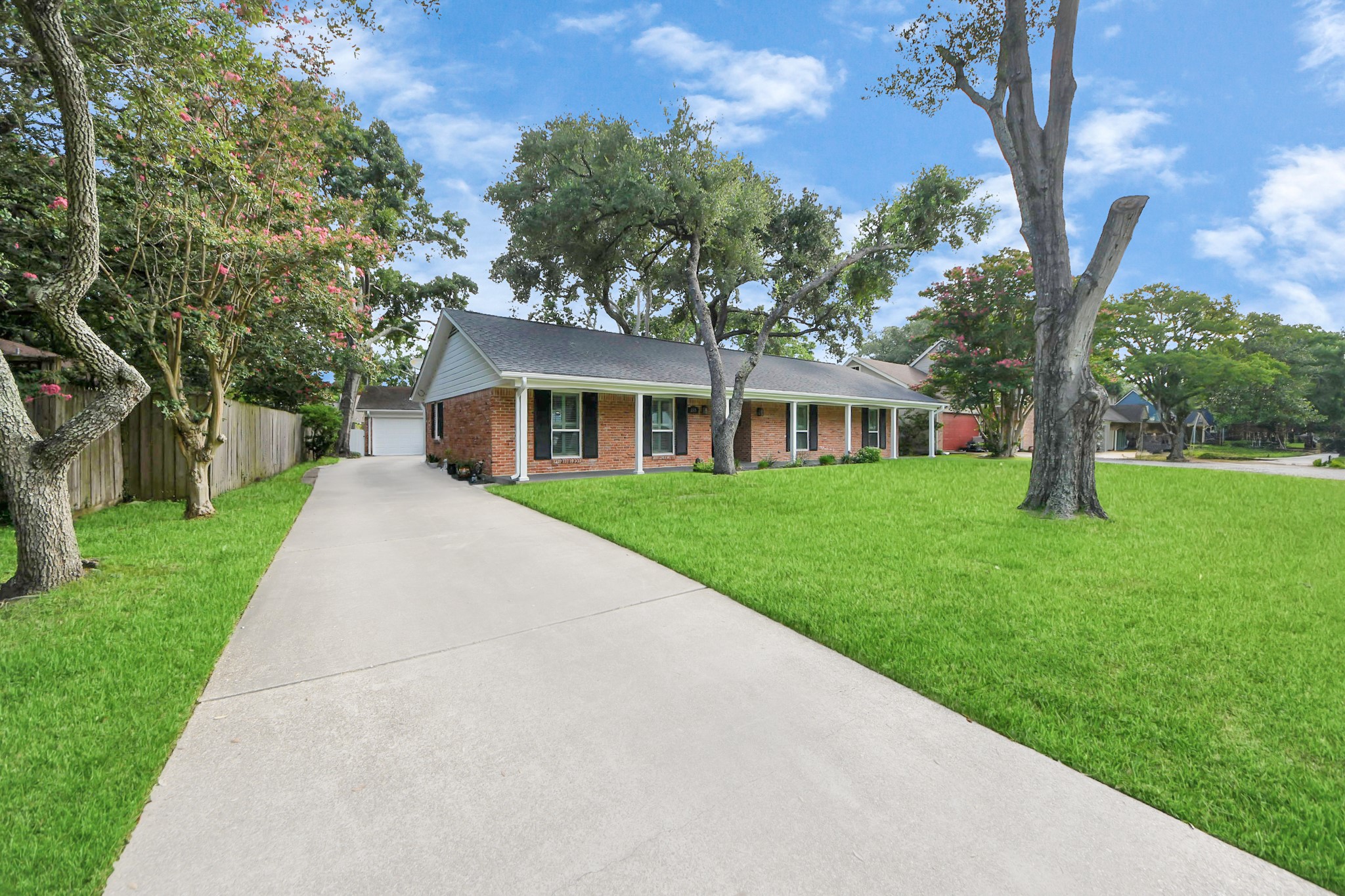 205 Cedar Lane El Lago, TX 77586 - Photo 42 of 44 a view of house in front of a big yard with large trees