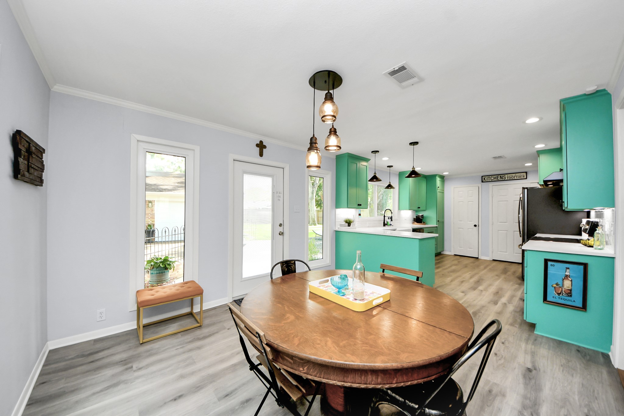 205 Cedar Lane El Lago, TX 77586 - Photo 7 of 44 a view of a dining room with furniture and wooden floor