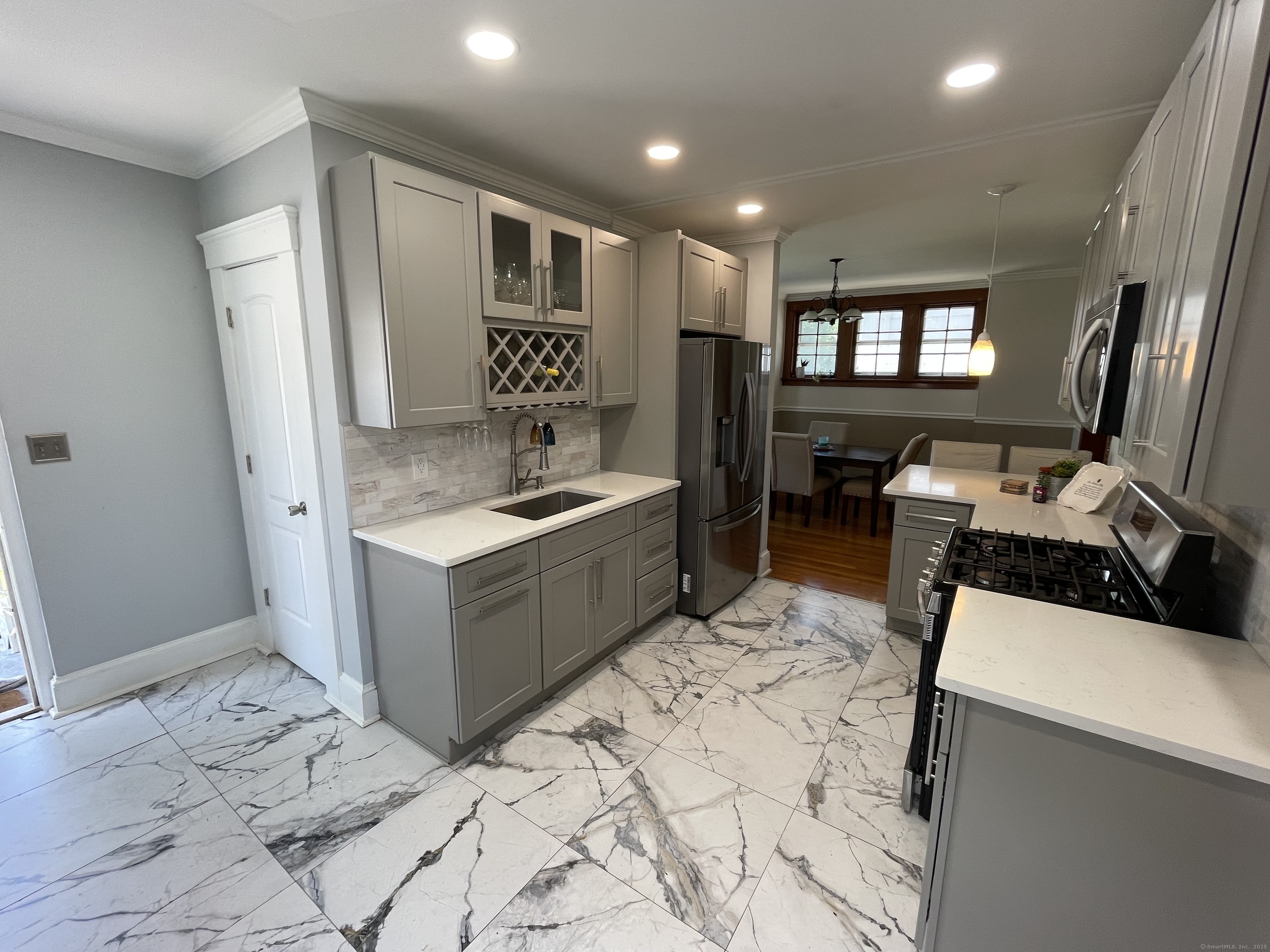 33 Mather Street Hamden, CT 06517 - Photo 13 of 22 a kitchen with stainless steel appliances kitchen island sink refrigerator and stove