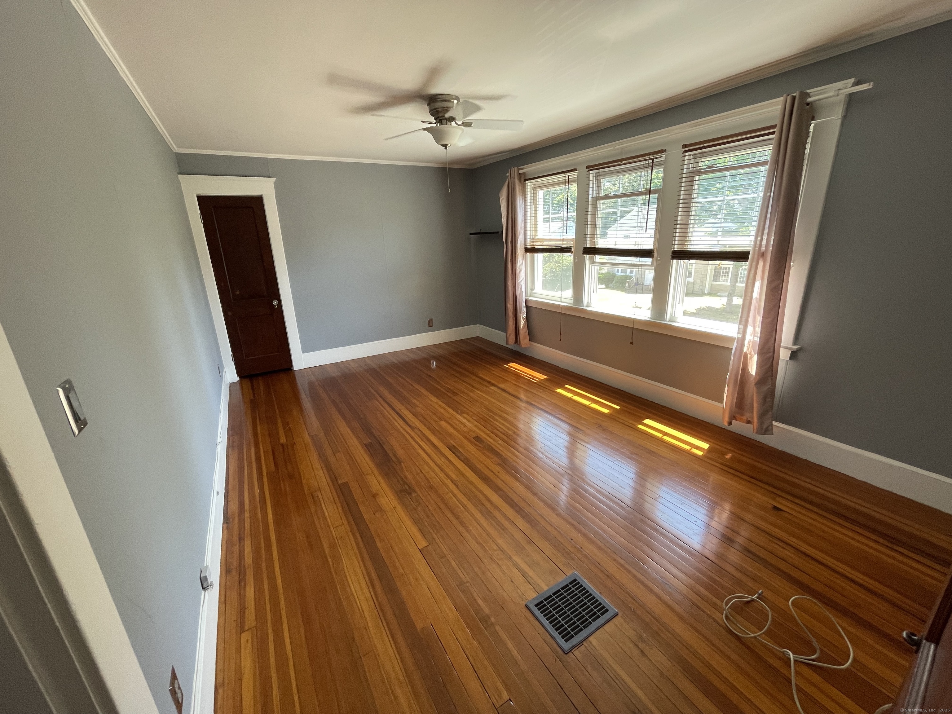 33 Mather Street Hamden, CT 06517 - Photo 19 of 22 a view of an empty room with wooden floor and a window