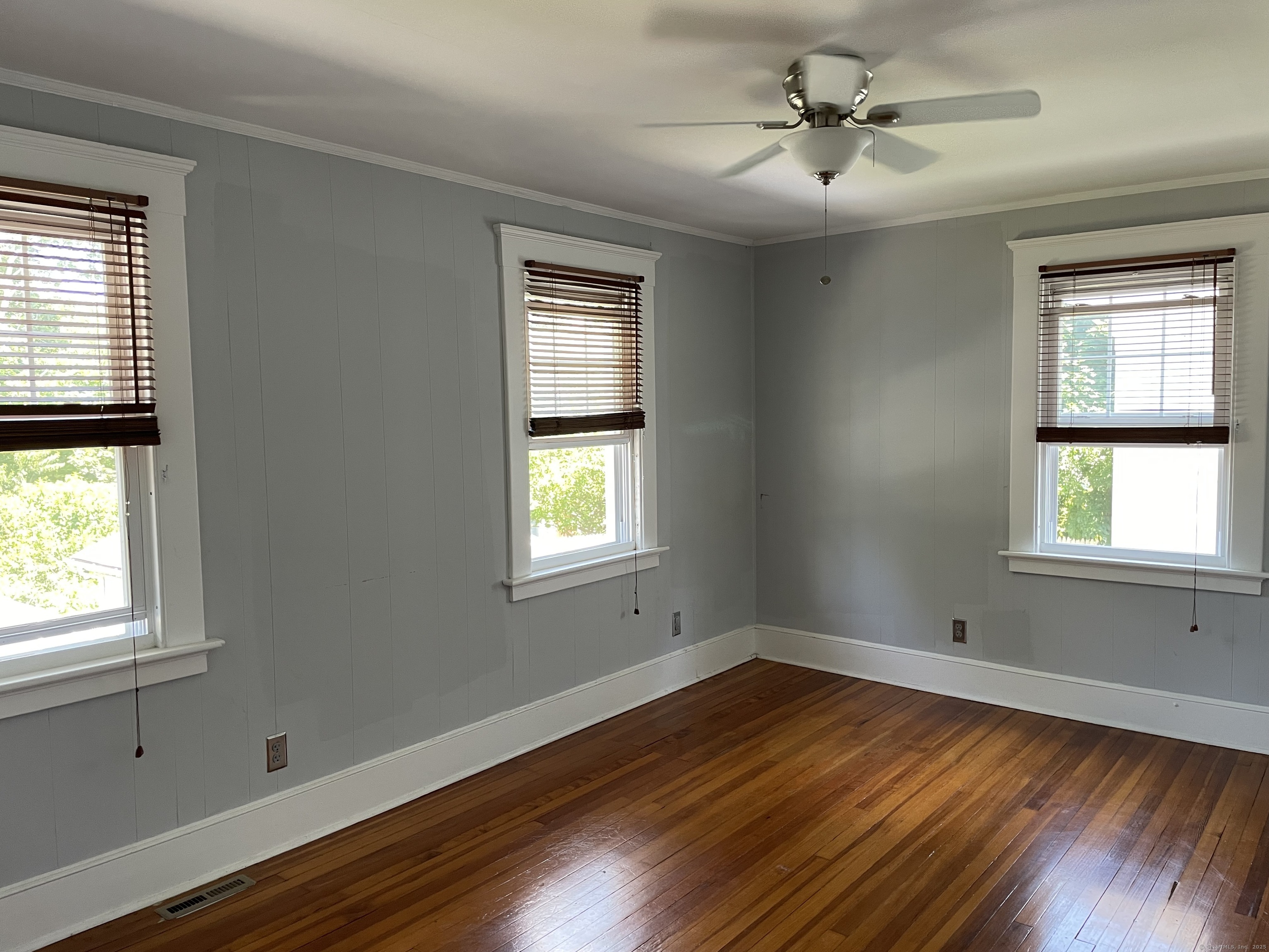 33 Mather Street Hamden, CT 06517 - Photo 21 of 22 a view of empty room with wooden floor and fan