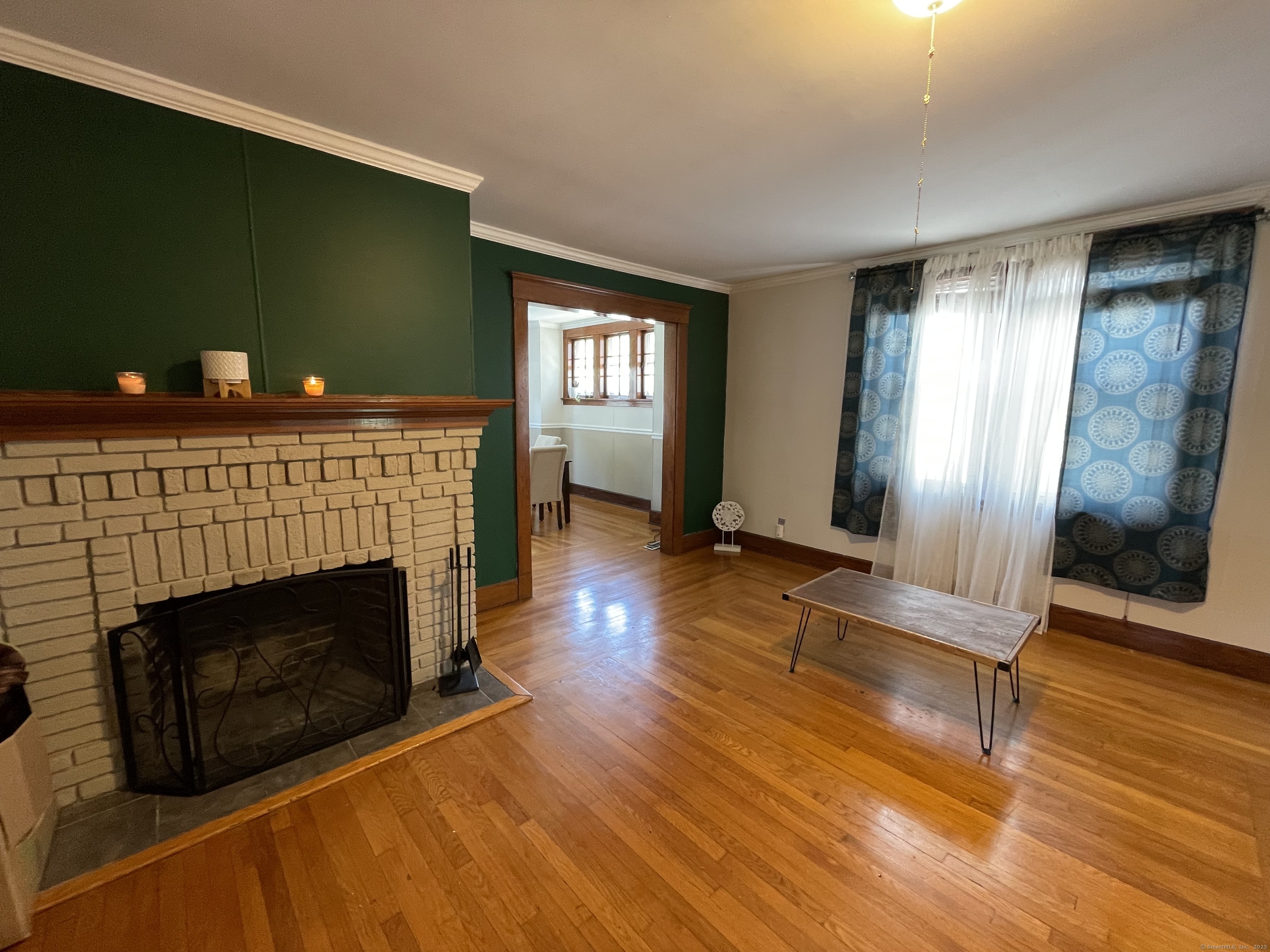 33 Mather Street Hamden, CT 06517 - Photo 7 of 22 a living room with furniture and a fireplace