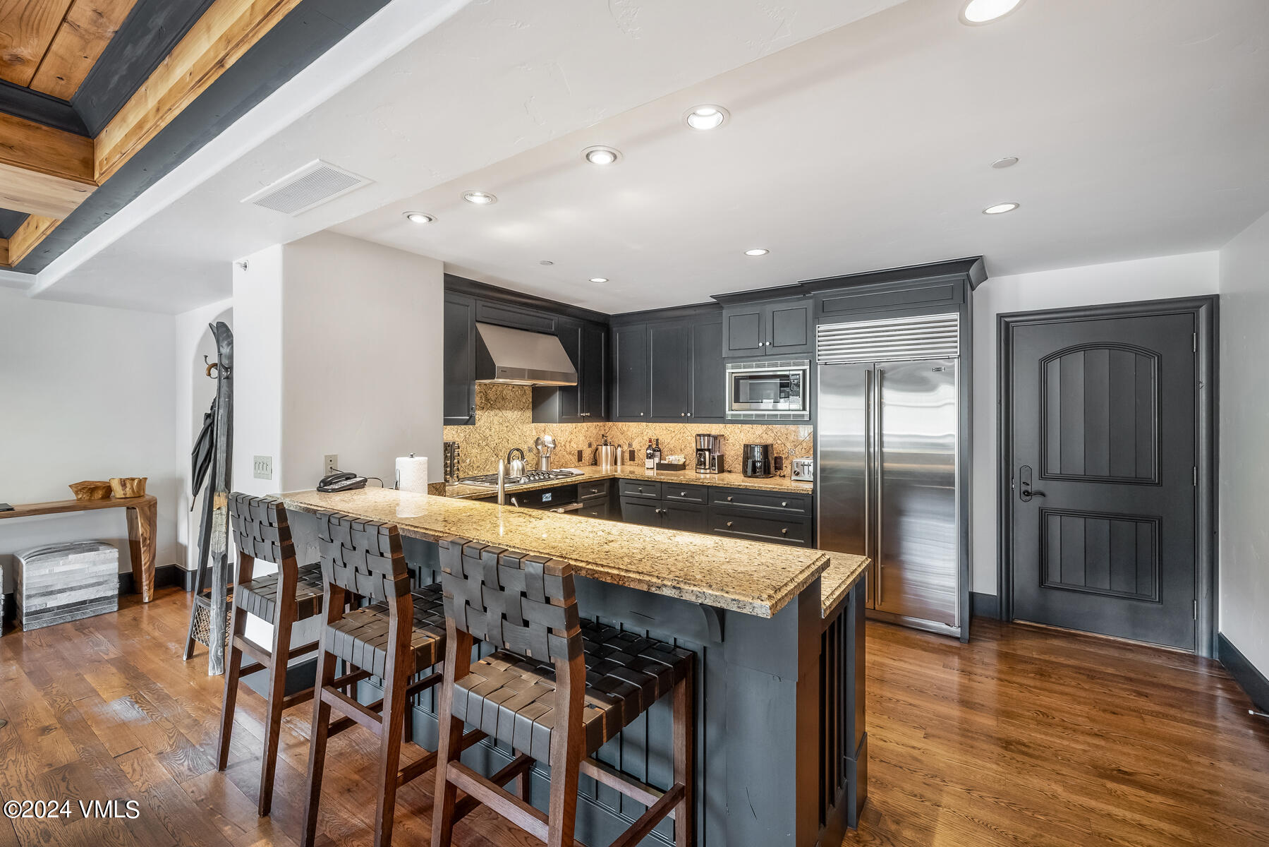 130 Daybreak Ridge Road, Unit R907 Avon, CO 81620 - Photo 12 of 49 a large kitchen with a table and chairs
