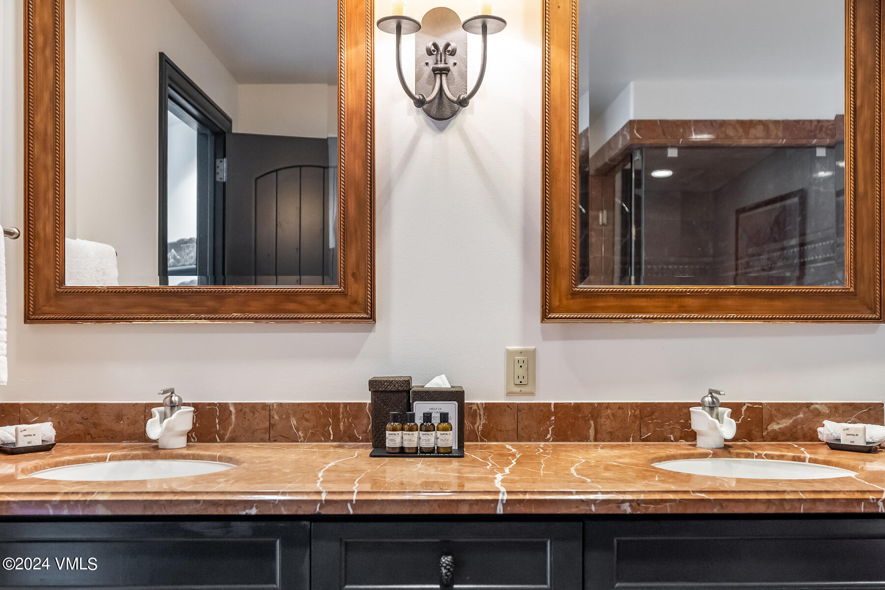 130 Daybreak Ridge Road, Unit R907 Avon, CO 81620 - Photo 24 of 49 a bathroom with a sink and a mirror