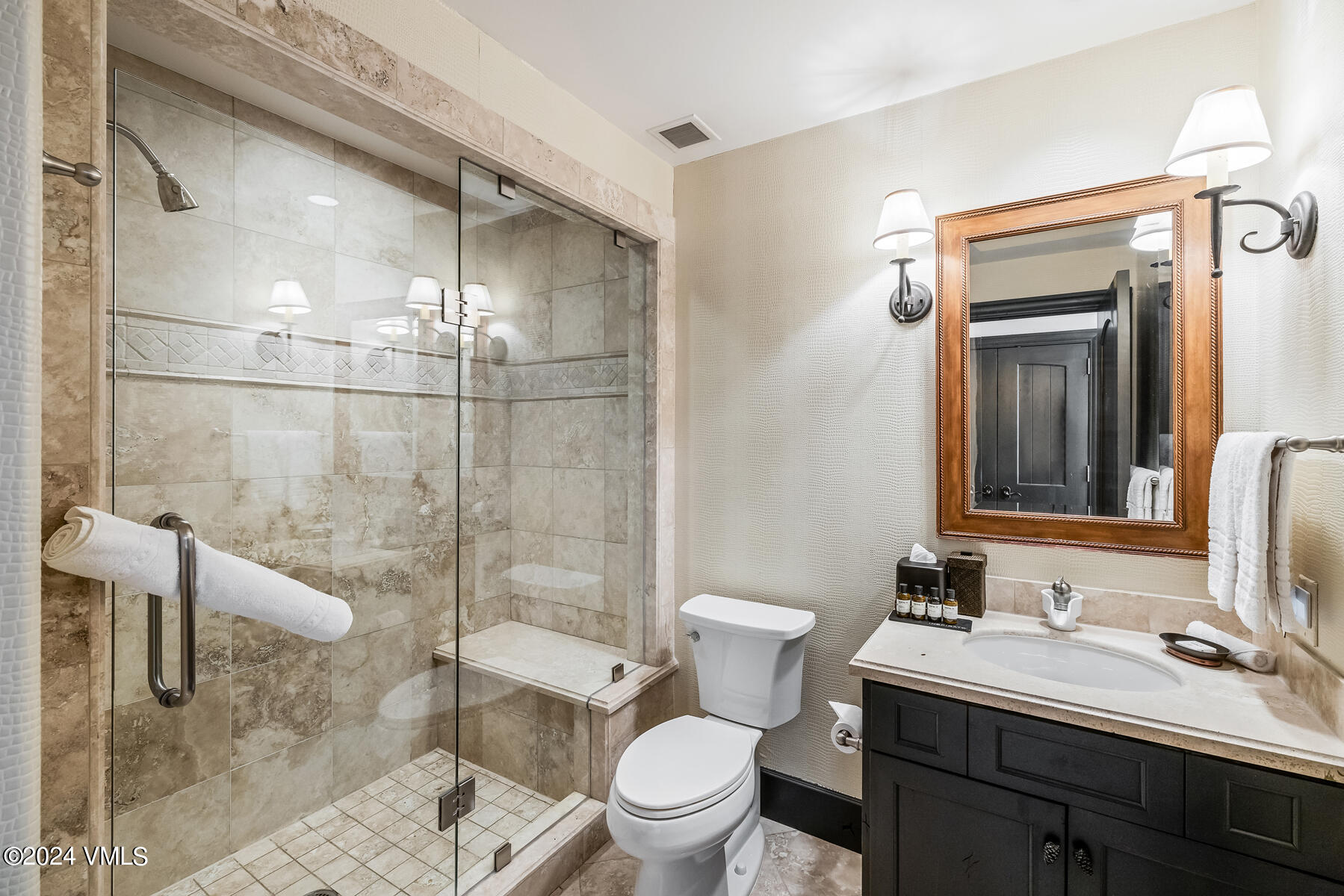 130 Daybreak Ridge Road, Unit R907 Avon, CO 81620 - Photo 27 of 49 a bathroom with a sink a toilet and shower