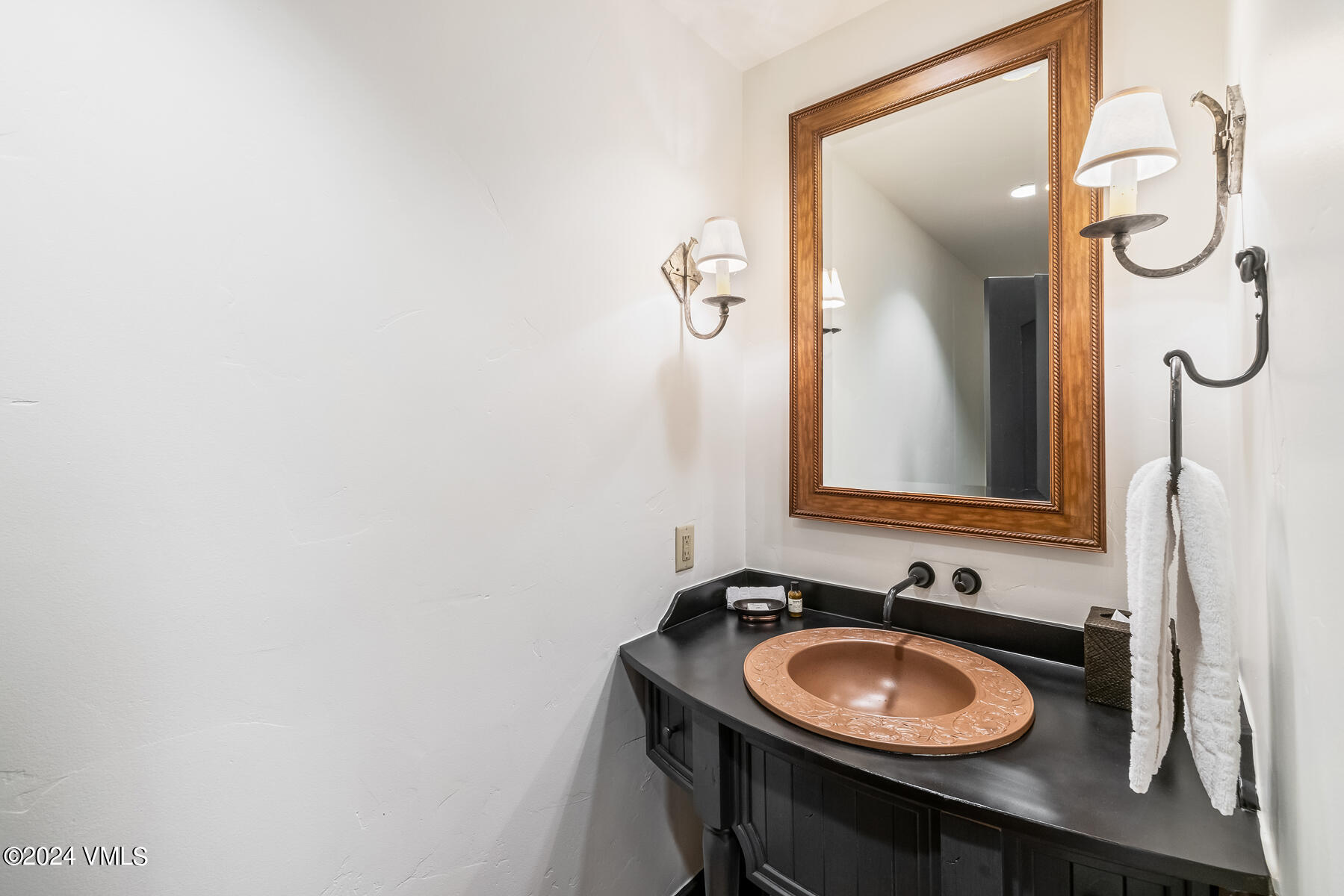 130 Daybreak Ridge Road, Unit R907 Avon, CO 81620 - Photo 32 of 49 a bathroom with a sink and a mirror