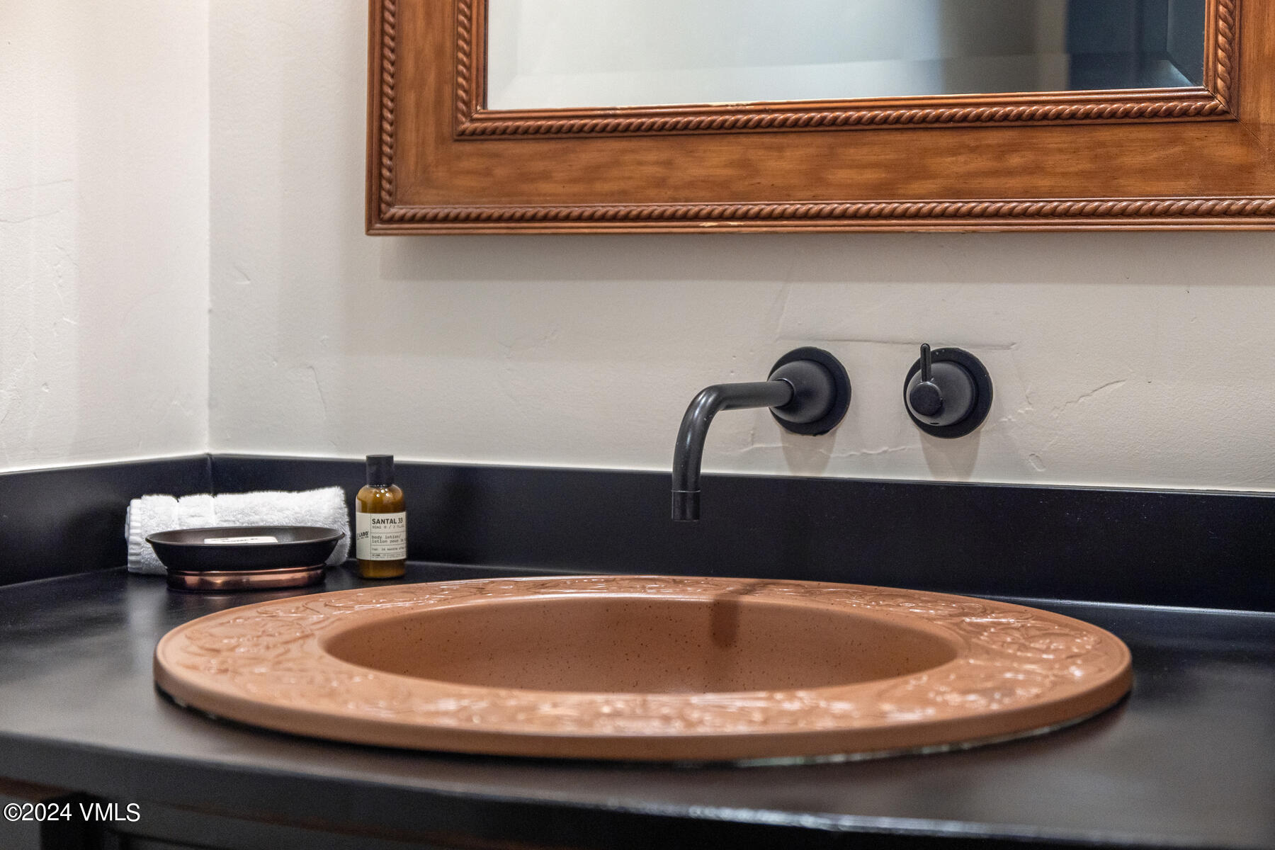 130 Daybreak Ridge Road, Unit R907 Avon, CO 81620 - Photo 33 of 49 a table with chairs and a wooden floor