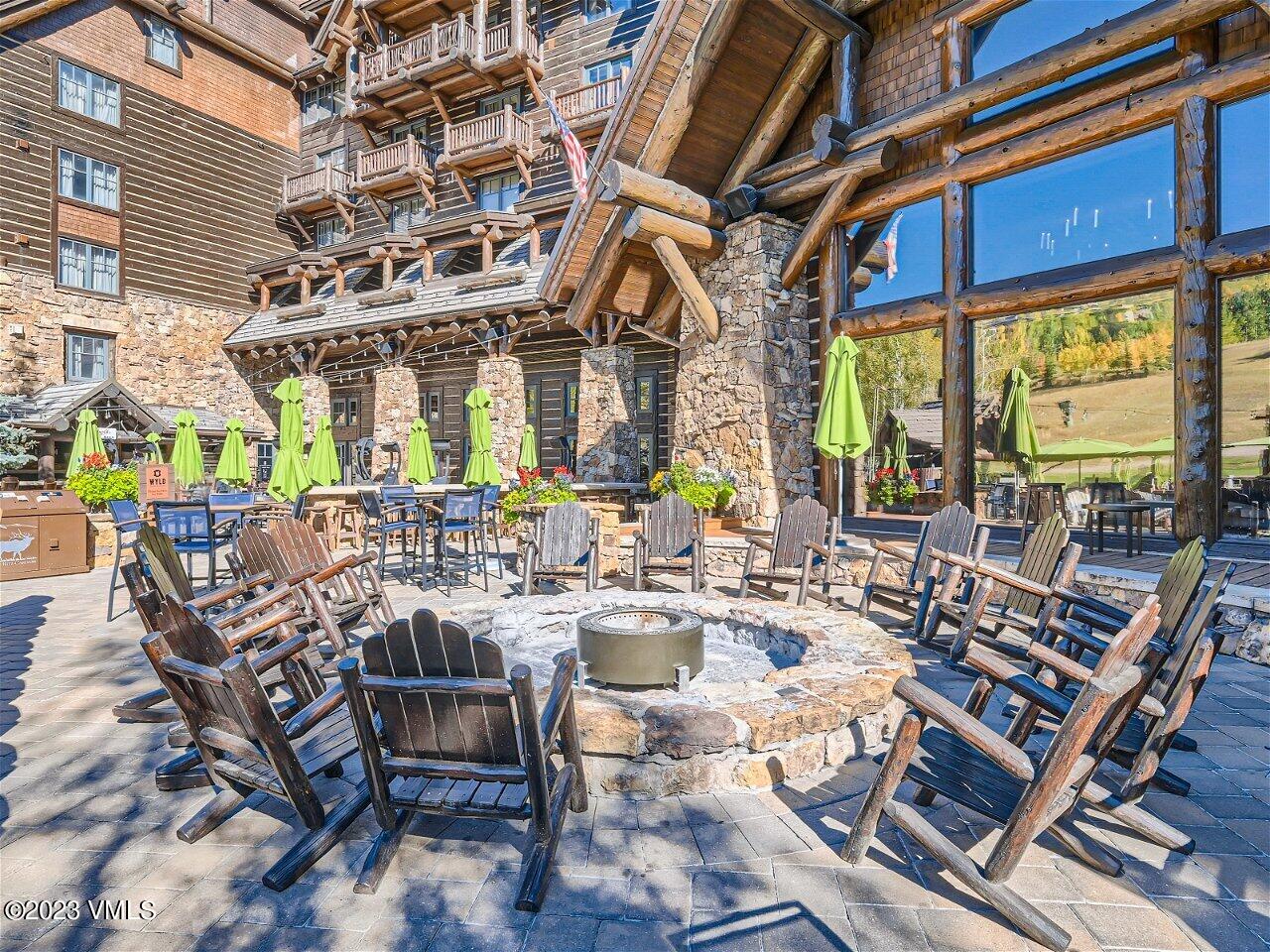 130 Daybreak Ridge Road, Unit R907 Avon, CO 81620 - Photo 37 of 49 a view of a chairs and table in a patio