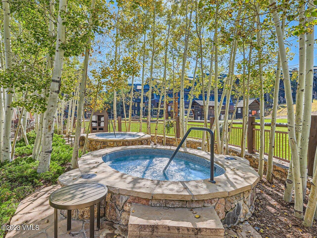 130 Daybreak Ridge Road, Unit R907 Avon, CO 81620 - Photo 39 of 49 a view of swimming pool with sitting area