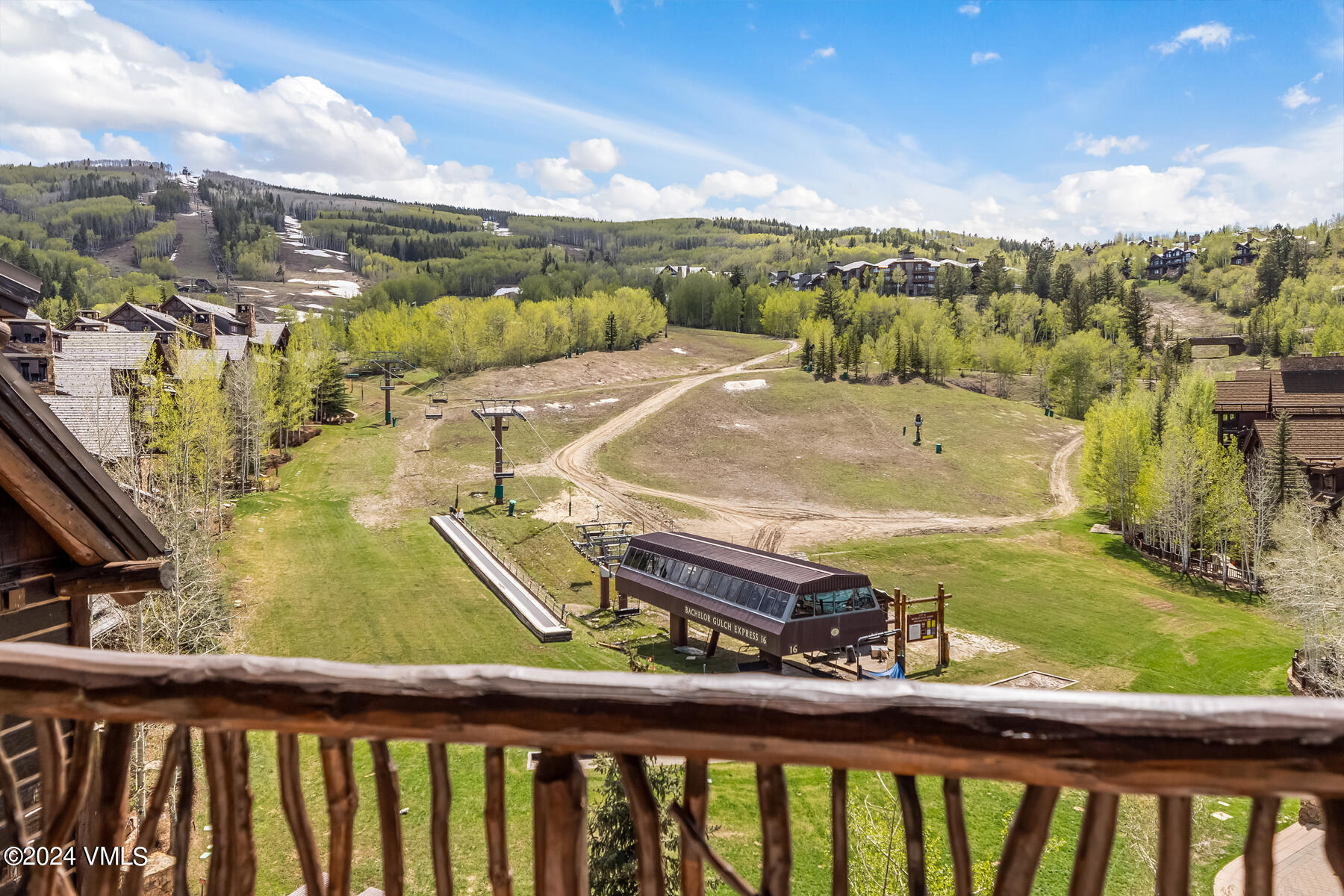 130 Daybreak Ridge Road, Unit R907 Avon, CO 81620 - Photo 4 of 49 a view of a swimming pool with a yard