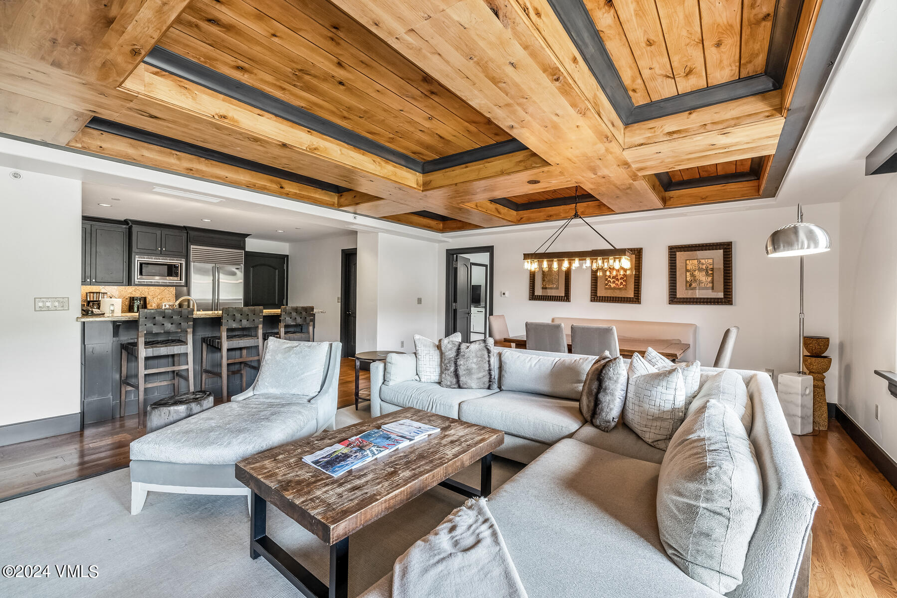 130 Daybreak Ridge Road, Unit R907 Avon, CO 81620 - Photo 7 of 49 a living room with furniture and a table