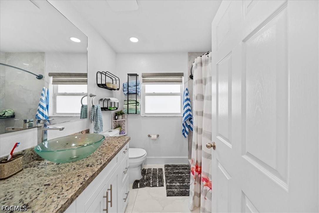 22 Nelson Road South Cape Coral, FL 33991 - Photo 22 of 43 a kitchen with a refrigerator and a sink