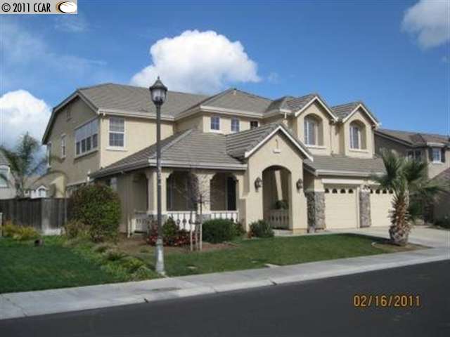 3526 Keystone Loop Discovery Bay, CA 94505 - Photo 1 of 1 a front view of a house with a garden