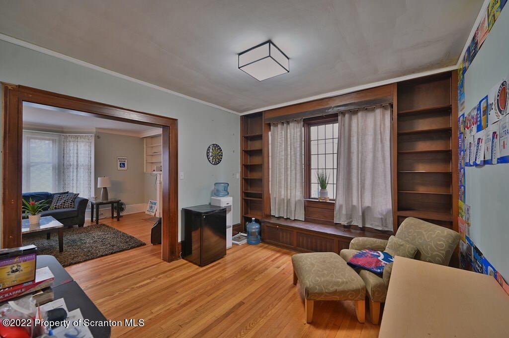 811 Olive Street Scranton, PA 18510 - Photo 14 of 54 a bedroom with a bed and wooden floor