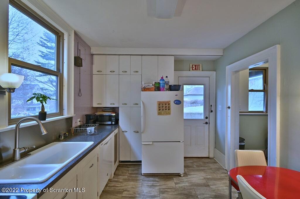 811 Olive Street Scranton, PA 18510 - Photo 17 of 54 a kitchen with refrigerator and window