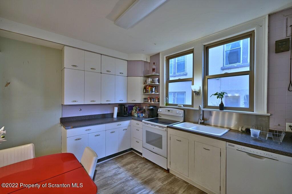 811 Olive Street Scranton, PA 18510 - Photo 18 of 54 a kitchen with a sink stove and cabinets