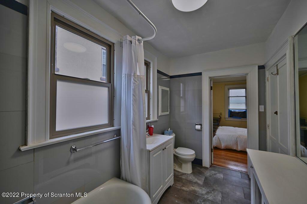 811 Olive Street Scranton, PA 18510 - Photo 24 of 54 a en suite bathroom with a granite countertop sink toilet and shower