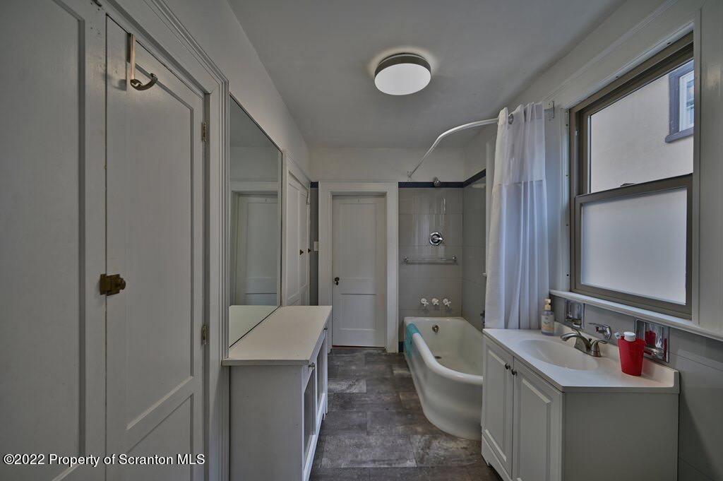 811 Olive Street Scranton, PA 18510 - Photo 25 of 54 a bathroom with a sink a toilet and shower