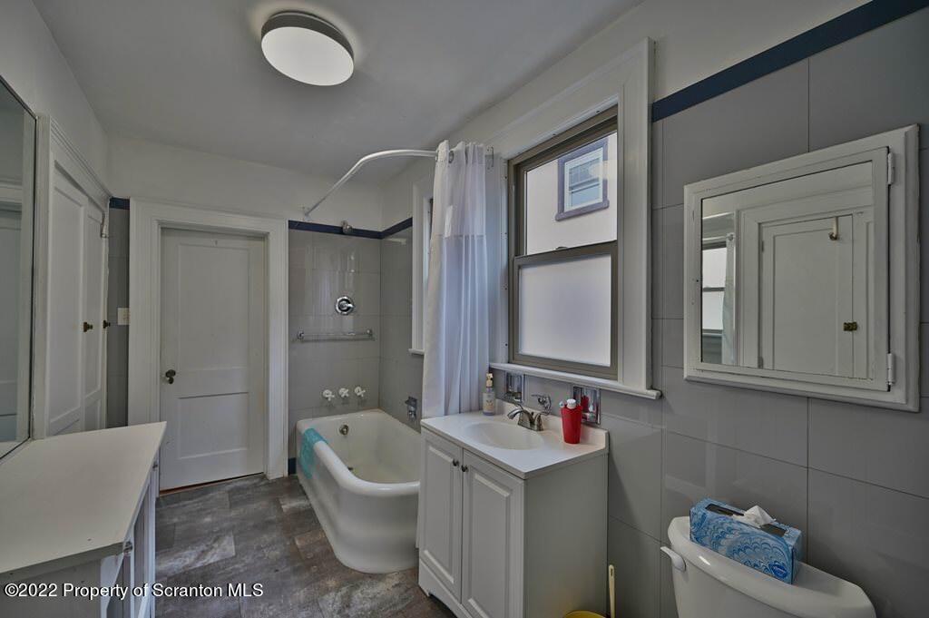 811 Olive Street Scranton, PA 18510 - Photo 26 of 54 a bathroom with a tub sink and mirror