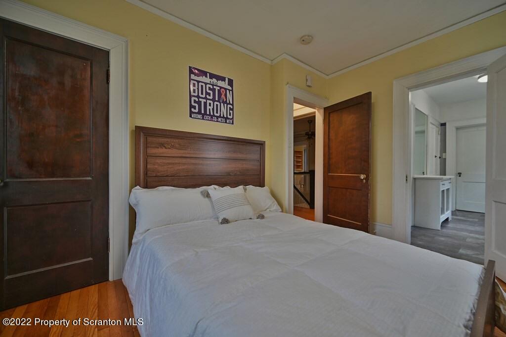 811 Olive Street Scranton, PA 18510 - Photo 28 of 54 a bedroom with a bed and a shower