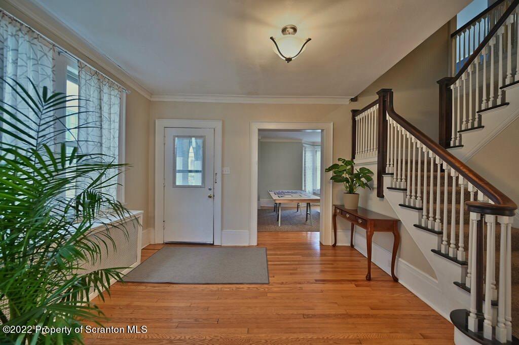 811 Olive Street Scranton, PA 18510 - Photo 3 of 54 a view of entryway with wooden floor and stairs