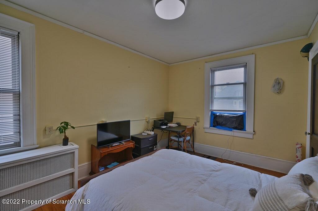 811 Olive Street Scranton, PA 18510 - Photo 31 of 54 a bedroom with a bed and a window
