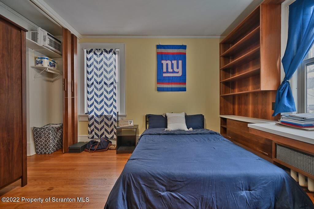 811 Olive Street Scranton, PA 18510 - Photo 32 of 54 a bedroom with a bed and a window