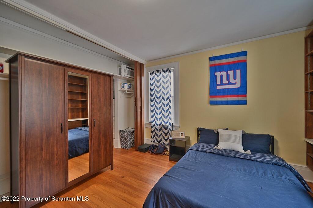 811 Olive Street Scranton, PA 18510 - Photo 33 of 54 a bedroom with furniture and wooden floor