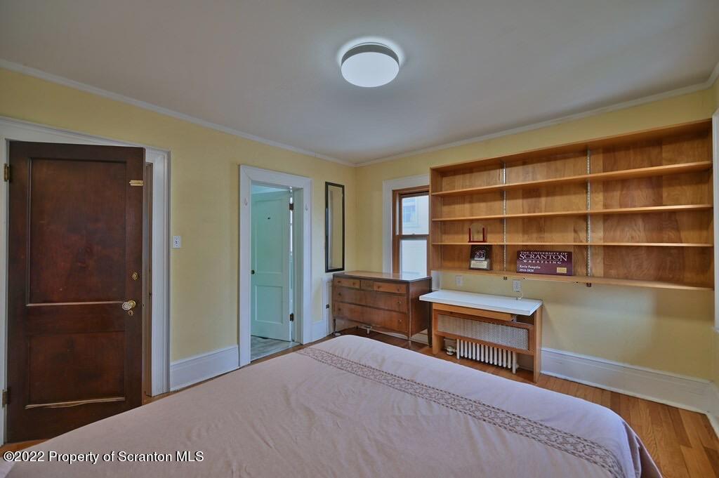 811 Olive Street Scranton, PA 18510 - Photo 40 of 54 a bedroom with a bed and a cabinets