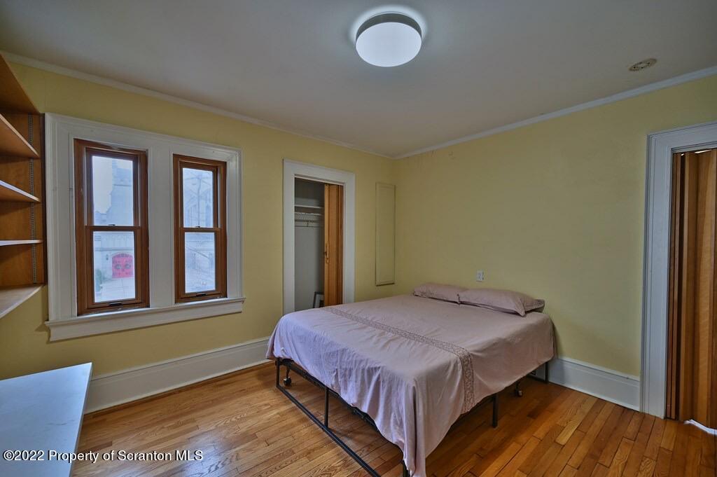811 Olive Street Scranton, PA 18510 - Photo 42 of 54 a bedroom with a bed and window