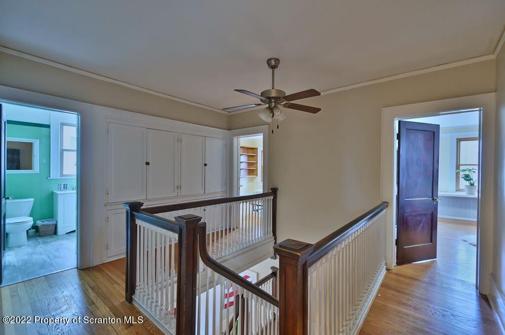811 Olive Street Scranton, PA 18510 - Photo 43 of 54 a view of a hallway with wooden floor and stairs