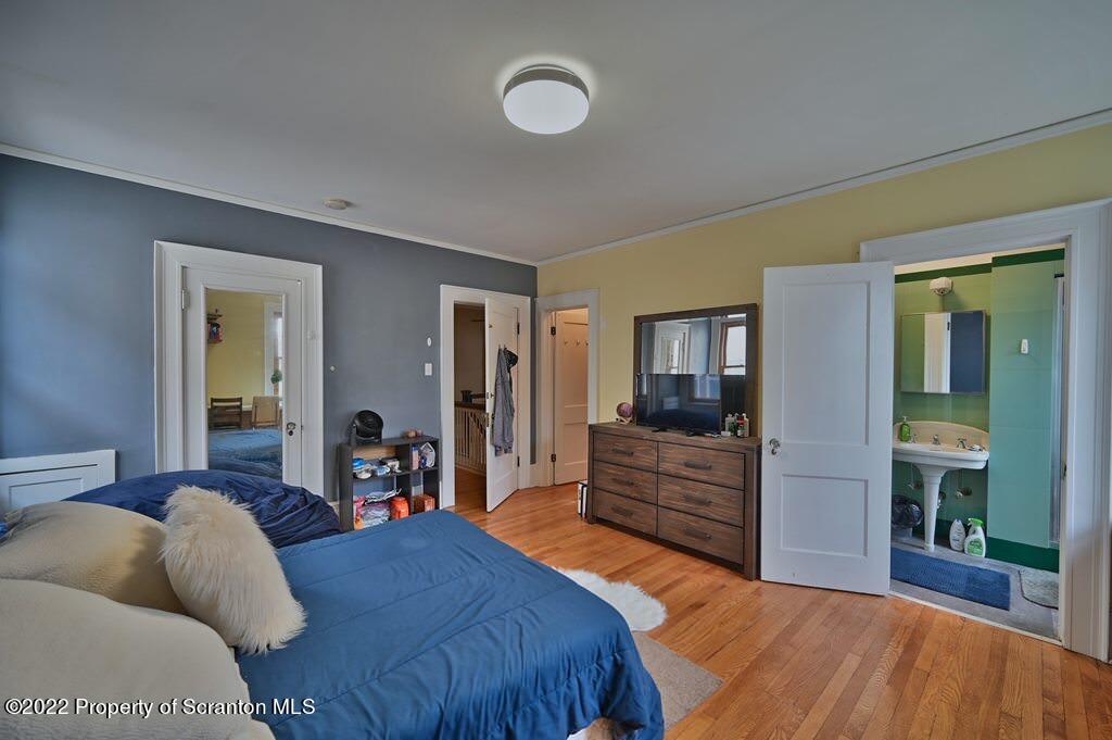 811 Olive Street Scranton, PA 18510 - Photo 46 of 54 a bedroom with a large bed and ceiling fan