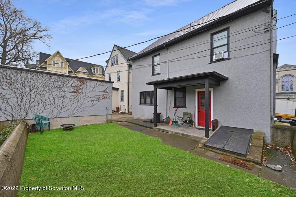 811 Olive Street Scranton, PA 18510 - Photo 49 of 54 a view of a chair and table in backyard of the house