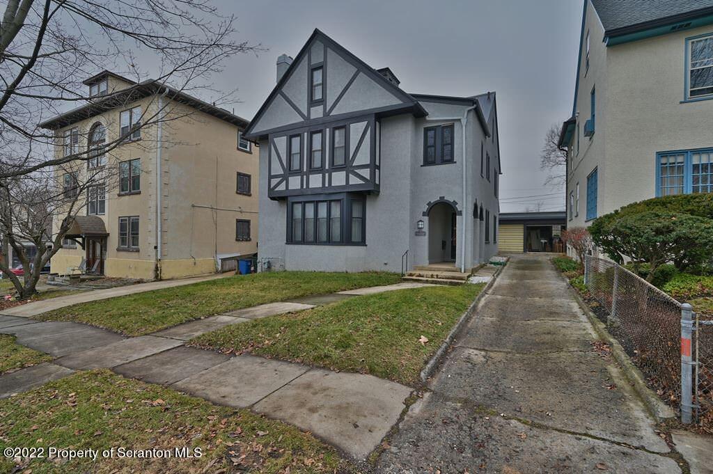 811 Olive Street Scranton, PA 18510 - Photo 53 of 54 a view of a big house with a big yard and large tree