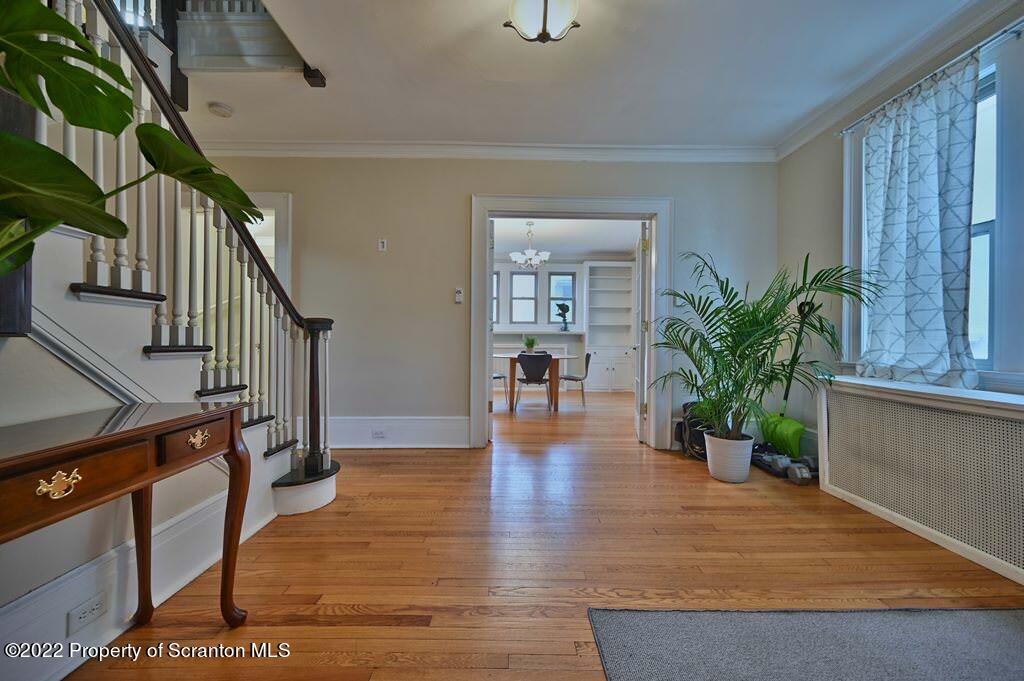 811 Olive Street Scranton, PA 18510 - Photo 7 of 54 a view of an entryway with wooden floor and a potted plant
