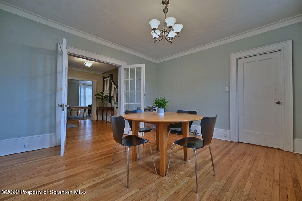 811 Olive Street Scranton, PA 18510 - Photo 8 of 54 a view of a dining room with furniture and wooden floor