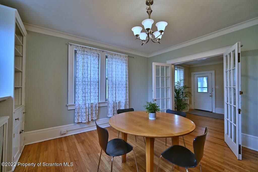 811 Olive Street Scranton, PA 18510 - Photo 10 of 54 a view of a dining room with furniture and wooden floor