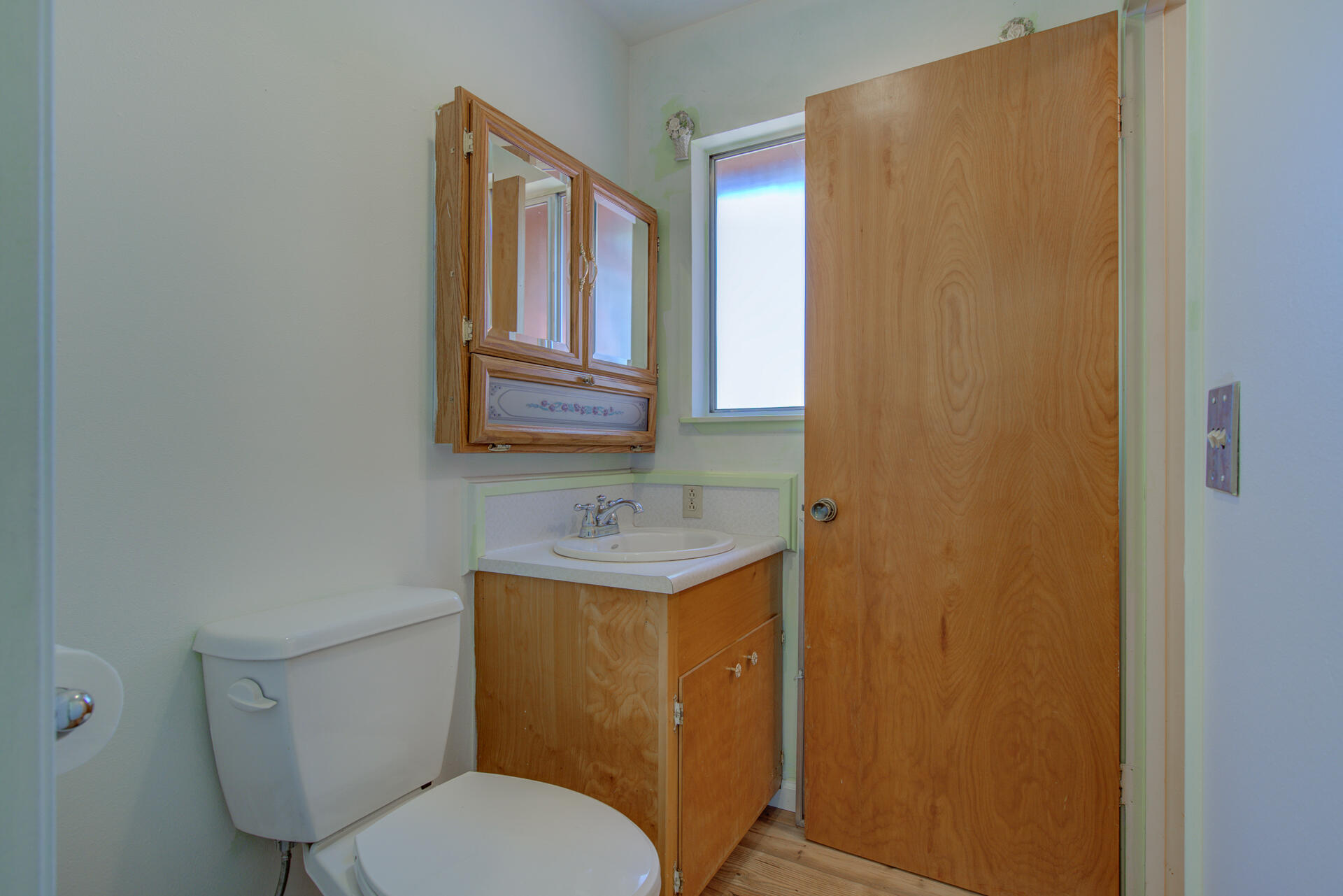 21694 Cassel Road Cassel, CA 96016 - Photo 29 of 65 a bathroom with a toilet a sink and mirror