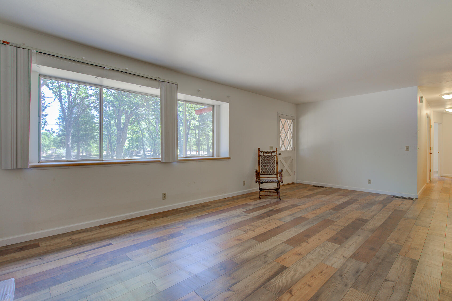 21694 Cassel Road Cassel, CA 96016 - Photo 9 of 65 a view of an empty room with wooden floor and a window
