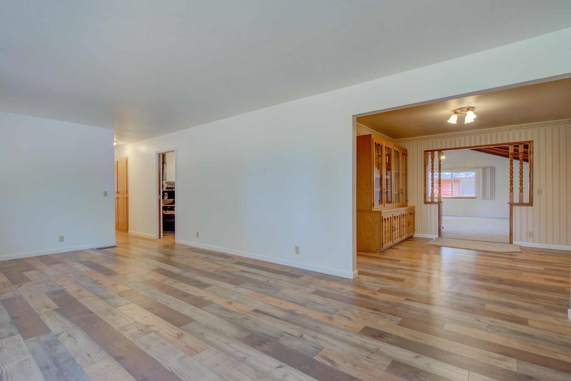 21694 Cassel Road Cassel, CA 96016 - Photo 10 of 65 a view of an empty room with wooden floor and a window
