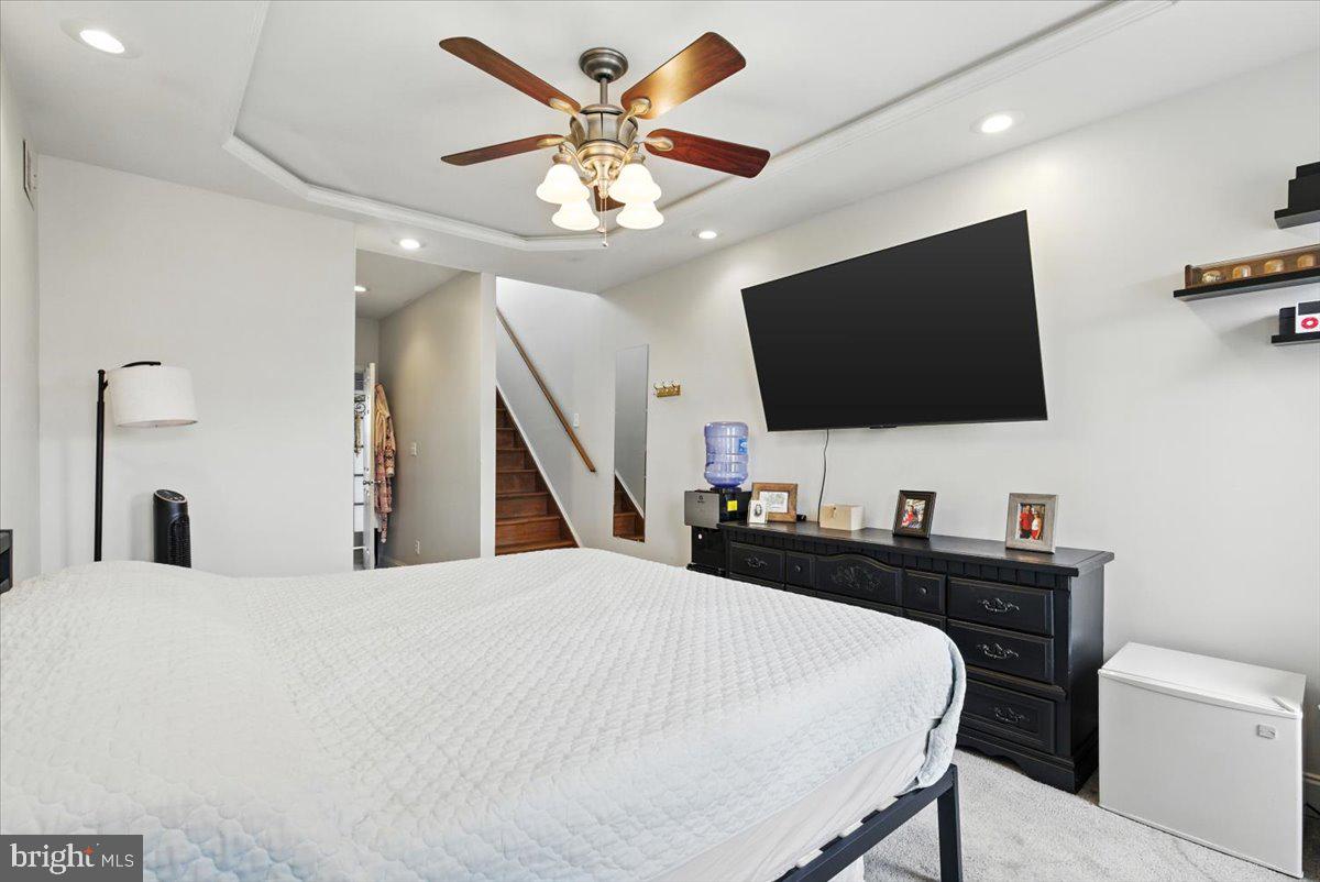 1711 South Hanover Street Baltimore, MD 21230 - Photo 23 of 31 a bedroom with a bed and a flat screen tv