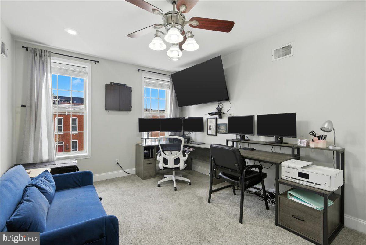 1711 South Hanover Street Baltimore, MD 21230 - Photo 26 of 31 a view of a livingroom with workspace and a couch