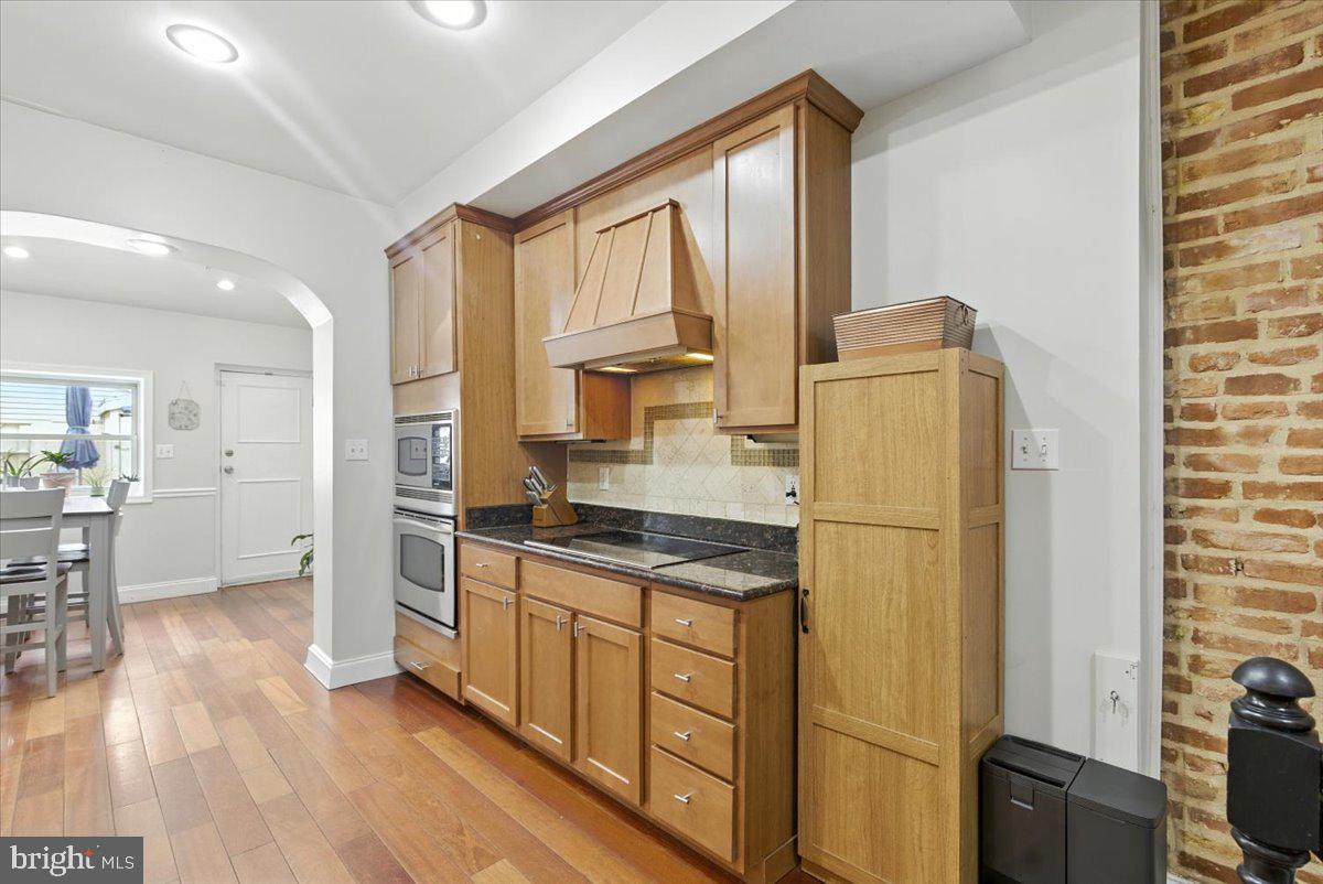1711 South Hanover Street Baltimore, MD 21230 - Photo 8 of 31 a kitchen with stainless steel appliances a refrigerator sink and cabinets