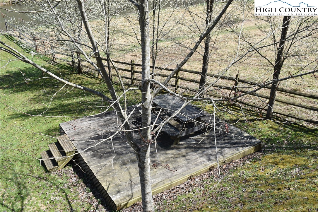 748 River Hills Road Lansing, NC 28643 - Photo 47 of 47 a view of a yard with an tree