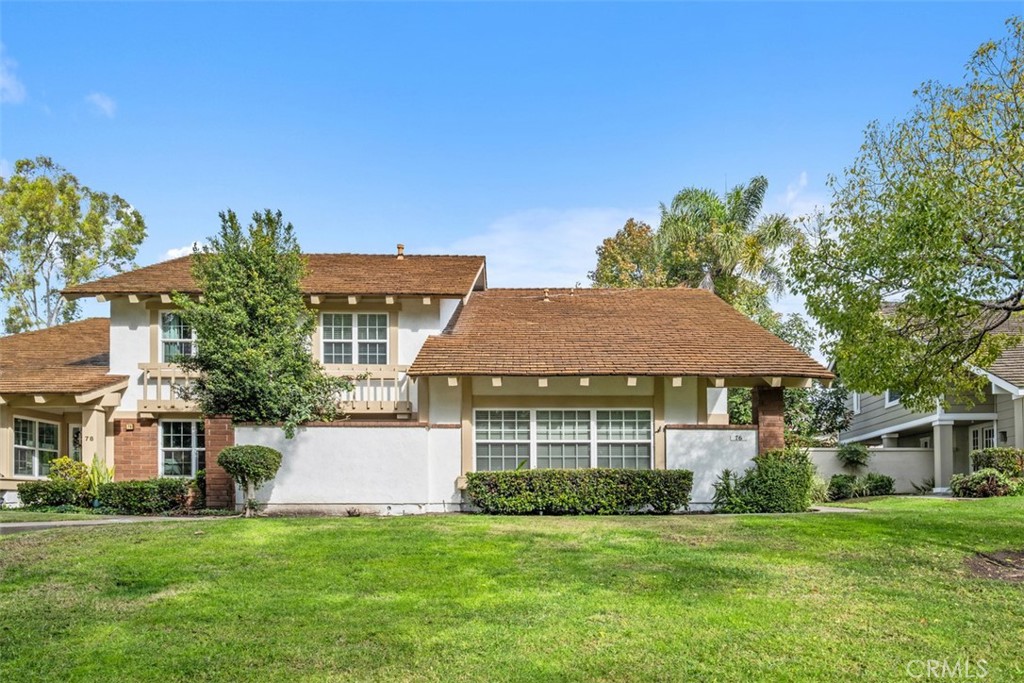 76 West Yale Loop Irvine, CA 92604 - Photo 1 of 11 a front view of a house with a garden