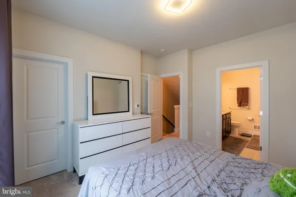 a bedroom with a bed and a closet