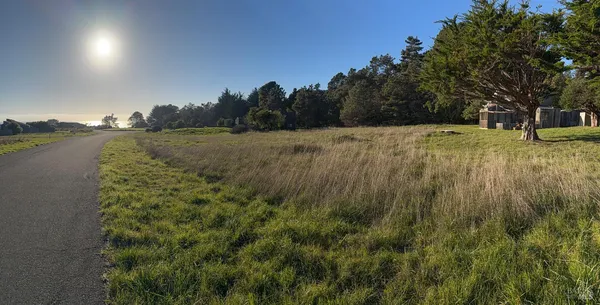 a view of lake with green space